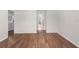 Living room with hardwood floors, with views to the kitchen and backyard at 204 Cactusflower Ln, Sun City Center, FL 33573