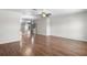Open-concept living area with hardwood floors and neutral paint scheme at 204 Cactusflower Ln, Sun City Center, FL 33573