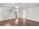 Inviting living room showcasing hardwood floors and open access to the kitchen at 204 Cactusflower Ln, Sun City Center, FL 33573