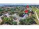 An aerial view of a community showcasing a pool, green spaces, and parking at 2501 Harn Blvd # H39, Clearwater, FL 33764
