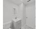 Clean bathroom features a modern gray vanity with modern fixtures and tiled floors at 2501 Harn Blvd # H39, Clearwater, FL 33764