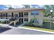 Charming two-story condo building with well-maintained landscaping and convenient carport parking for residents at 2501 Harn Blvd # H39, Clearwater, FL 33764