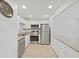 Bright kitchen features stainless steel appliances, granite countertops, and tiled floors at 2501 Harn Blvd # H39, Clearwater, FL 33764
