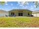 Backyard with a patio area and outdoor seating at 25304 Lexington Oaks Blvd, Wesley Chapel, FL 33544
