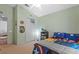 View of bedroom, with superhero bedding and vaulted ceiling at 25304 Lexington Oaks Blvd, Wesley Chapel, FL 33544