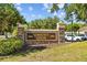 Elegant stone community center sign surrounded by lush greenery and mature trees at 25304 Lexington Oaks Blvd, Wesley Chapel, FL 33544