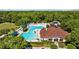 Aerial view showcases the community pool, clubhouse, and recreational area, perfect for Gathering fun at 25304 Lexington Oaks Blvd, Wesley Chapel, FL 33544