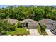 Charming single-Gathering home with a well-manicured lawn, classic architecture, and a welcoming two-car garage at 25304 Lexington Oaks Blvd, Wesley Chapel, FL 33544