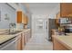Functional kitchen with tile floors, stainless steel appliances, and ample cabinet space at 25304 Lexington Oaks Blvd, Wesley Chapel, FL 33544