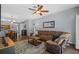Spacious living area with wood floors, comfortable sectional, and open flow at 25304 Lexington Oaks Blvd, Wesley Chapel, FL 33544