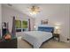 Main bedroom with ceiling fan, neutral colors and a view of the outdoor scenery at 25304 Lexington Oaks Blvd, Wesley Chapel, FL 33544