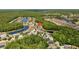 A beautiful view of the neighborhood from above showing the lakes and trees nearby at 25304 Lexington Oaks Blvd, Wesley Chapel, FL 33544