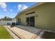 Back patio with seating at 25304 Lexington Oaks Blvd, Wesley Chapel, FL 33544