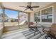 Enclosed patio with comfortable seating and outdoor views, perfect for relaxing at 2532 Fentress Pl, Holiday, FL 34691