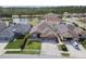An aerial view of a home with manicured lawn and lush landscaping at 2611 Eagle Crest Ct, Holiday, FL 34691