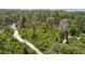 Lush green forest with walking trails, offering an escape into nature at 2611 Eagle Crest Ct, Holiday, FL 34691