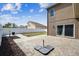 Paver patio with a small yard and a white fence surrounding the property at 2611 Eagle Crest Ct, Holiday, FL 34691