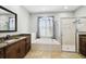 Bathroom with shower, bathtub, vanity, mirror, and natural stone floor at 2611 Eagle Crest Ct, Holiday, FL 34691