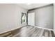 Bedroom with hardwood flooring, closet, and ample light from a single window at 2611 Eagle Crest Ct, Holiday, FL 34691