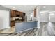 Modern kitchen featuring stainless steel appliances, granite countertops, and hardwood floors at 2611 Eagle Crest Ct, Holiday, FL 34691
