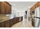 Well-equipped kitchen with stainless steel appliances, granite countertops, and stylish tiled backsplash at 2611 Eagle Crest Ct, Holiday, FL 34691