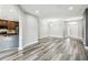 Open floor plan living room featuring hardwood floors and access to kitchen at 2611 Eagle Crest Ct, Holiday, FL 34691