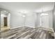 Bright and airy living space featuring hardwood floors, neutral walls, and stylish light fixtures at 2611 Eagle Crest Ct, Holiday, FL 34691