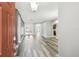 Bright and airy living space featuring hardwood floors, neutral walls, and arched doorway at 2611 Eagle Crest Ct, Holiday, FL 34691