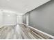 Inviting living room with hardwood floors, neutral paint, and an open floor plan at 2611 Eagle Crest Ct, Holiday, FL 34691