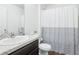 Clean and modern bathroom with a shower and ample vanity space at 26377 Bertram Rd, Brooksville, FL 34602