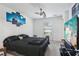 Cozy bedroom with a ceiling fan and a view of the neighborhood at 26377 Bertram Rd, Brooksville, FL 34602