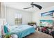 Bright bedroom with a ceiling fan and a TV at 26377 Bertram Rd, Brooksville, FL 34602