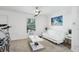 Living room with white couch and a telescope in front of the window at 26377 Bertram Rd, Brooksville, FL 34602
