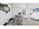 Living room featuring white walls, a large window, and a drum set at 26377 Bertram Rd, Brooksville, FL 34602