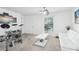 Living room featuring white walls, a large window, and furniture at 26377 Bertram Rd, Brooksville, FL 34602