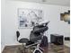 Versatile room with sleek floors and a view of an abstract painting at 26377 Bertram Rd, Brooksville, FL 34602