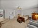 Additional view of the primary bedroom suite with carpeting, ceiling fan, and seating at 27231 Liriope Ct, Wesley Chapel, FL 33544