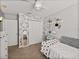 This bedroom is decorated with a patterned wall, a closet, and a mirror at 27231 Liriope Ct, Wesley Chapel, FL 33544
