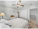 The bedroom features a bed and storage, with a glimpse into the hallway at 27231 Liriope Ct, Wesley Chapel, FL 33544