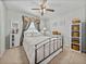 The spacious bedroom features a queen-sized bed with decor and a ceiling fan at 27231 Liriope Ct, Wesley Chapel, FL 33544