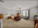 Spacious main bedroom with neutral color scheme, ceiling fan, and ample natural light at 27231 Liriope Ct, Wesley Chapel, FL 33544