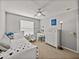 This bedroom includes a ceiling fan and ample space for a bed and a desk at 27231 Liriope Ct, Wesley Chapel, FL 33544