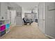 Carpeted bonus room with ceiling fan, neutral colors, and adjacent rooms at 27231 Liriope Ct, Wesley Chapel, FL 33544