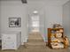 Hallway with carpeting, built in cabinets, and view of the bathroom at 27231 Liriope Ct, Wesley Chapel, FL 33544