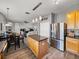 Spacious kitchen with stainless steel appliances, center island, and open floor plan at 27231 Liriope Ct, Wesley Chapel, FL 33544