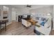 Bright living room with plush seating, and an entertainment center; ample natural light at 27231 Liriope Ct, Wesley Chapel, FL 33544