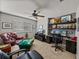 This carpeted office boasts ample natural light, ceiling fan, and built-in shelving at 27231 Liriope Ct, Wesley Chapel, FL 33544