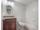 Bathroom features a vanity with granite countertop and a shower over bath at 3073 Overlook Pl, Clearwater, FL 33760