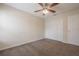 Spacious bedroom featuring a ceiling fan and large closet at 3073 Overlook Pl, Clearwater, FL 33760