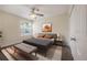 Bedroom with ceiling fan, neutral colors and a large window for natural light at 3073 Overlook Pl, Clearwater, FL 33760